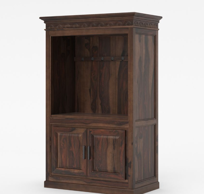 Black entertainment center with coffee-making equipment in a room with a chair and wall art.