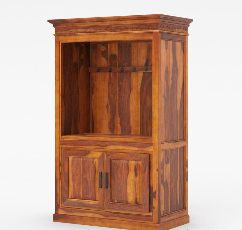 Black entertainment center with coffee-making equipment in a room with a chair and wall art.