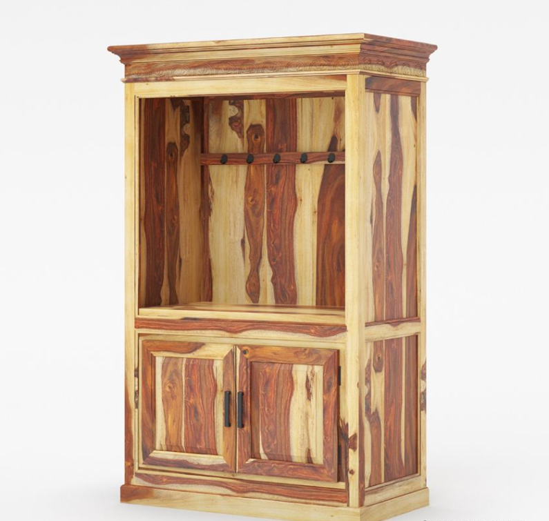 Black entertainment center with coffee-making equipment in a room with a chair and wall art.