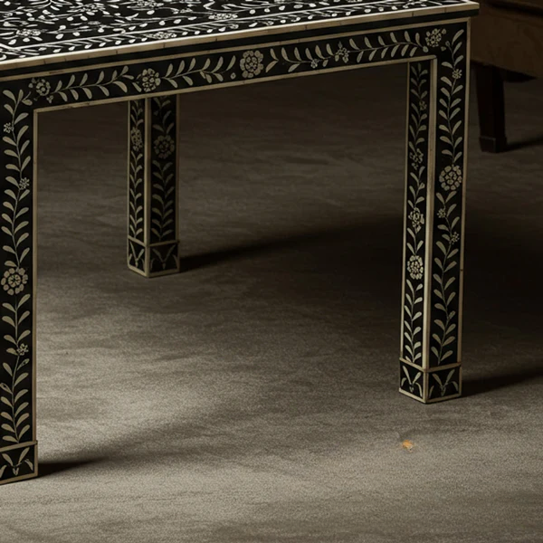 Decorative table with intricate patterns on a dark surface