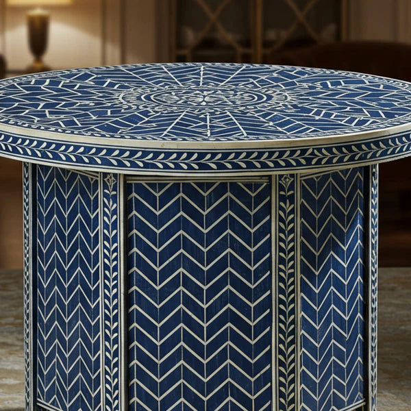 Round table with blue and white geometric pattern in a room setting