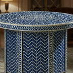 Round table with blue and white geometric pattern in a room setting